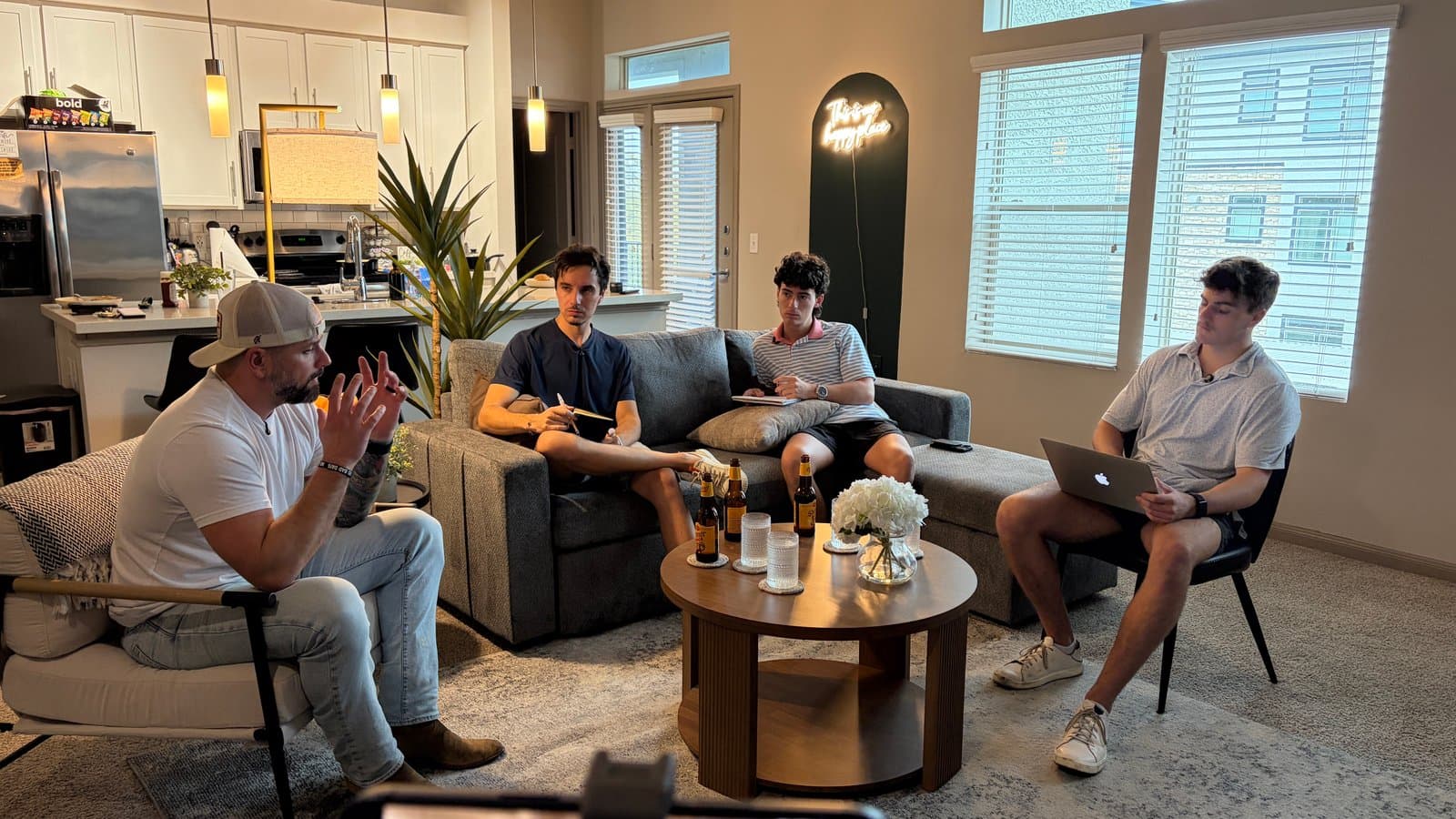 Mathis and the Be Human team discussing work together.